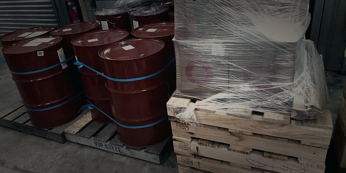 Honey drums and pallets as stock context